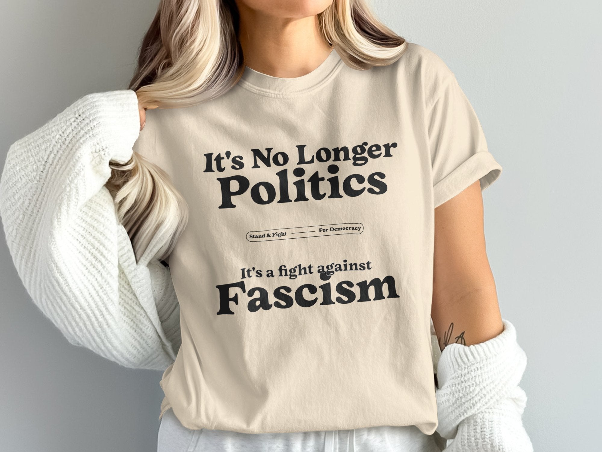 a woman wearing a t - shirt that says it's no longer politics